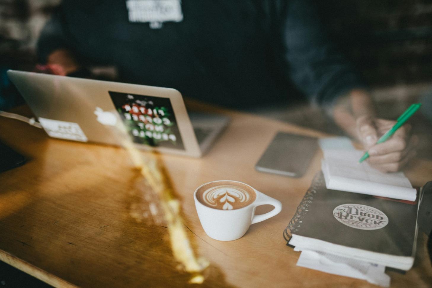 Student reviewing budget tracking methods on tablet
